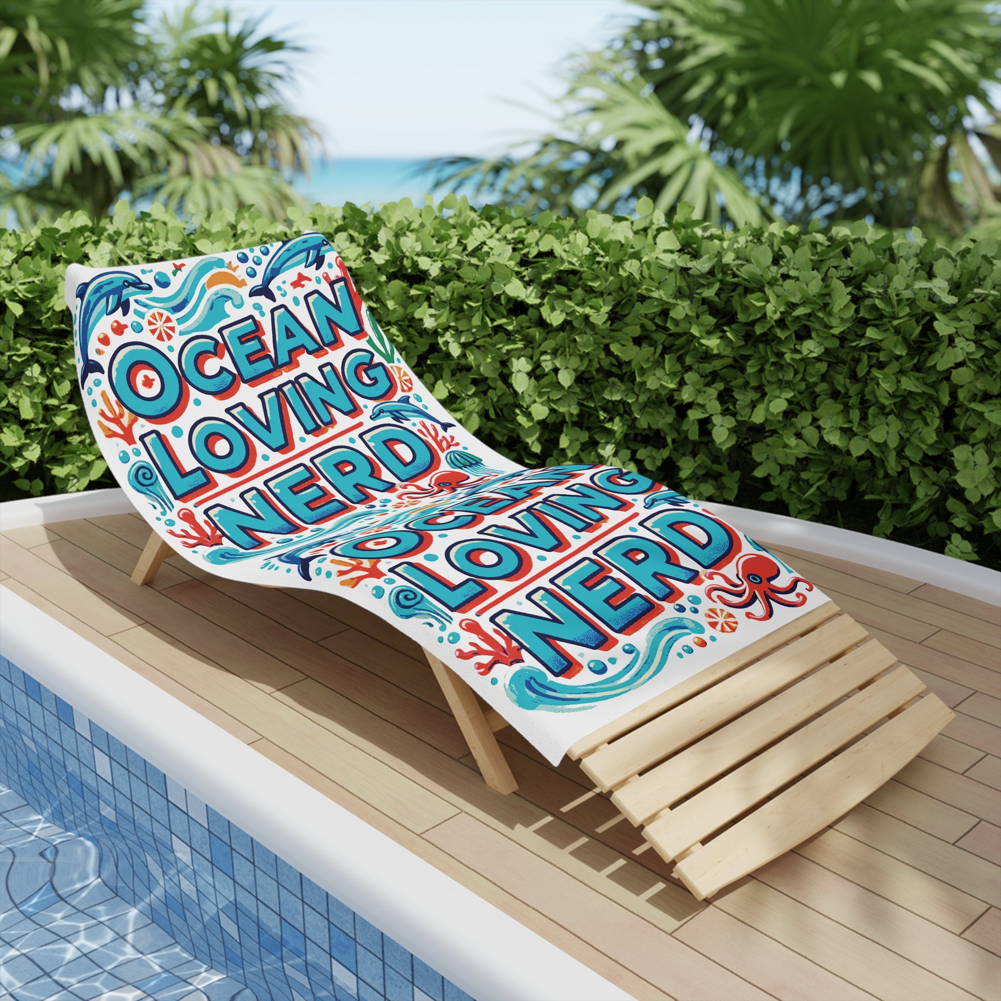 Ocean Loving Nerd in bold letters surrounded by sea animals on a beach towel
